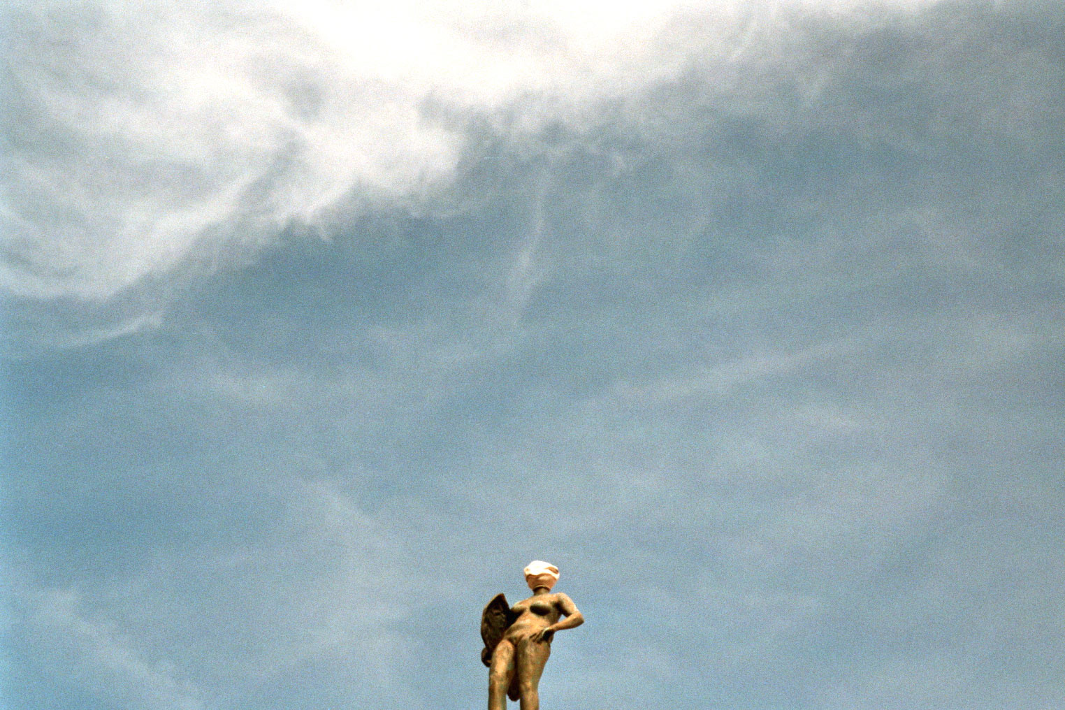 Prague old city blinded golden statue on a roof