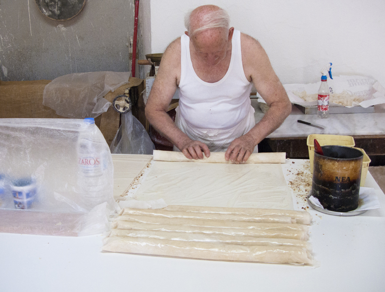 Creta rethymno man preparing baklava bakery