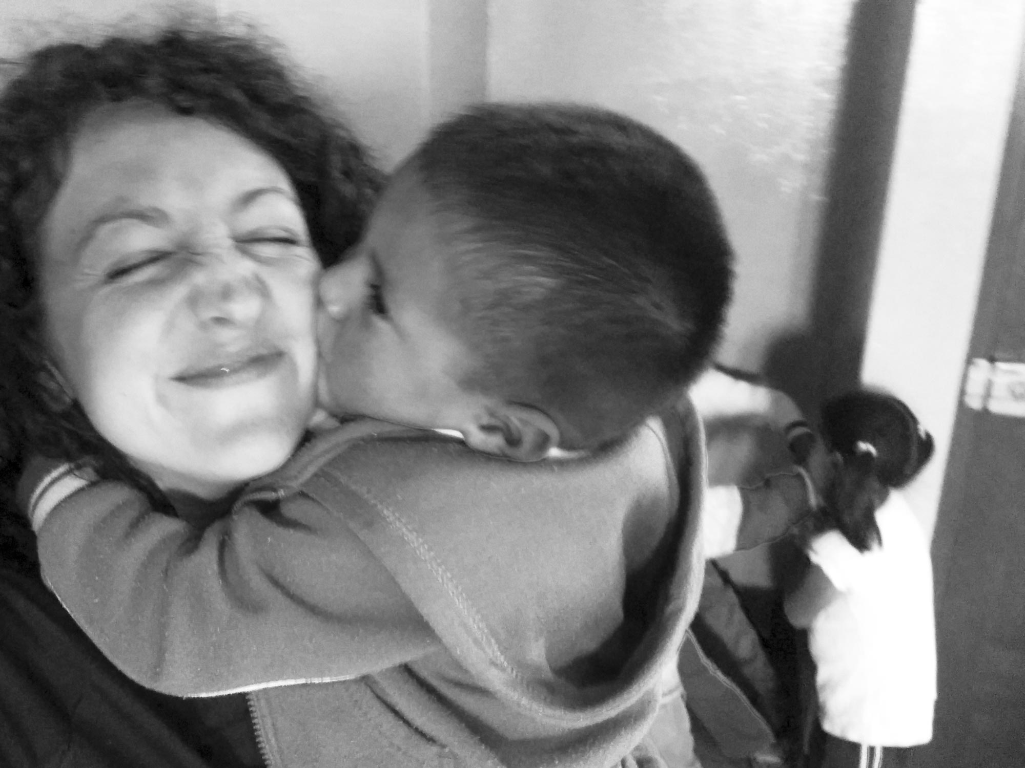 Peru Ayacucho Puericultorio kiss and hug from a kid