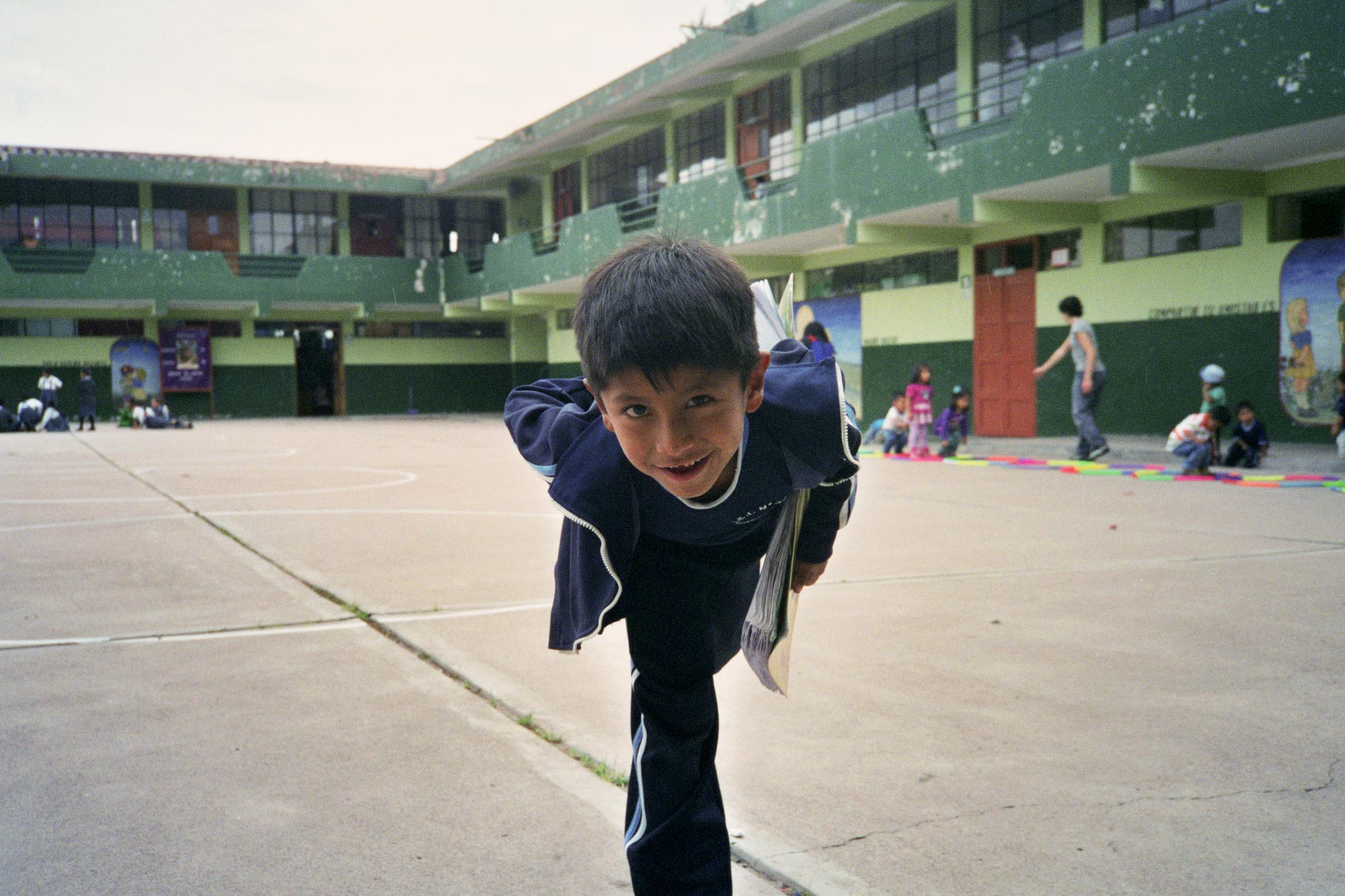 Peru Ayacucho Puericultorio smiling school kid in a break