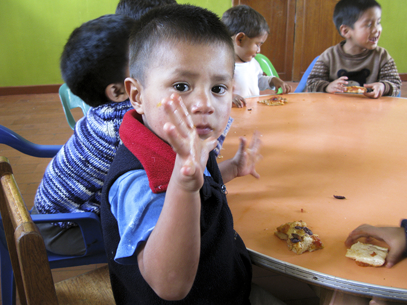 Peru Ayacucho Puericultorio volunteering pizza kid