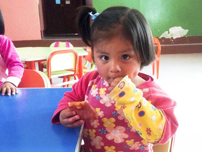 Peru Ayacucho Puericultorio volunteering pizza kid