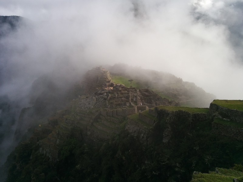 Peru machu Picchu mountains clouds sun