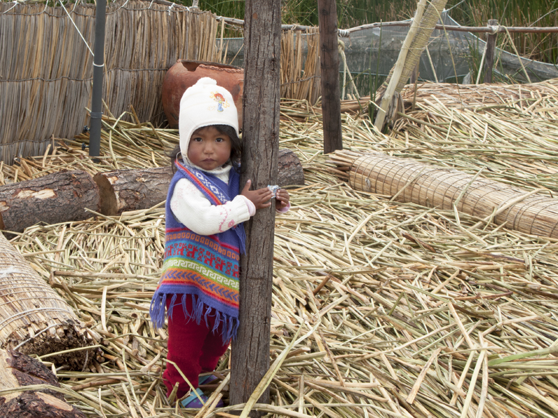 Peru Puno Titicaca ferry Uros island kid