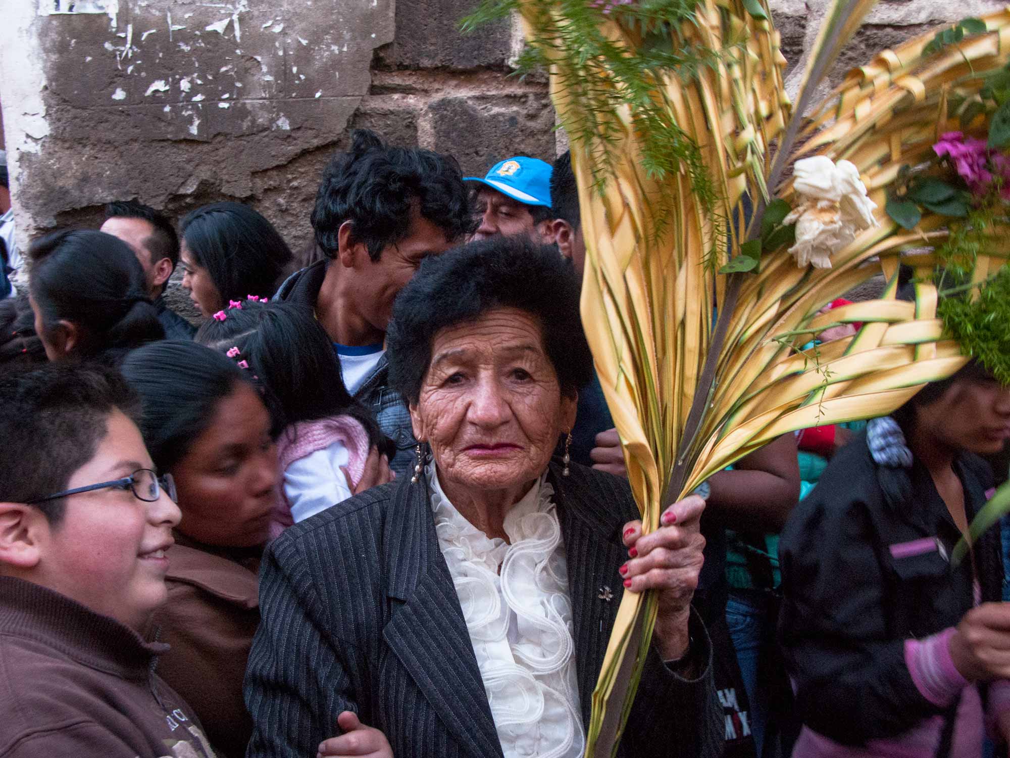 Peru Ayacucho Semana Santa woman holding a palm