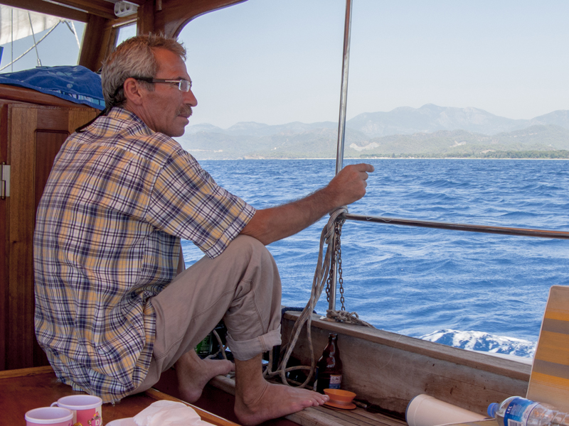 Turkey Fetihye Blue lagoons sea man boat trip