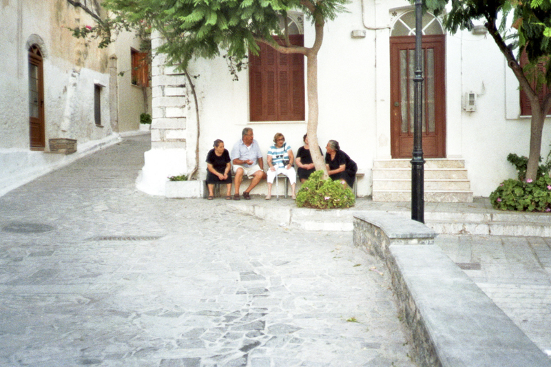 Greece Chios Island Pyrgi village people chatting in the street