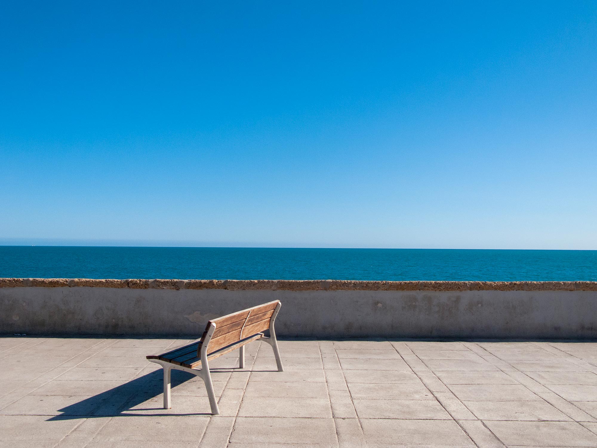 Cadiz a bench looking at the ocean