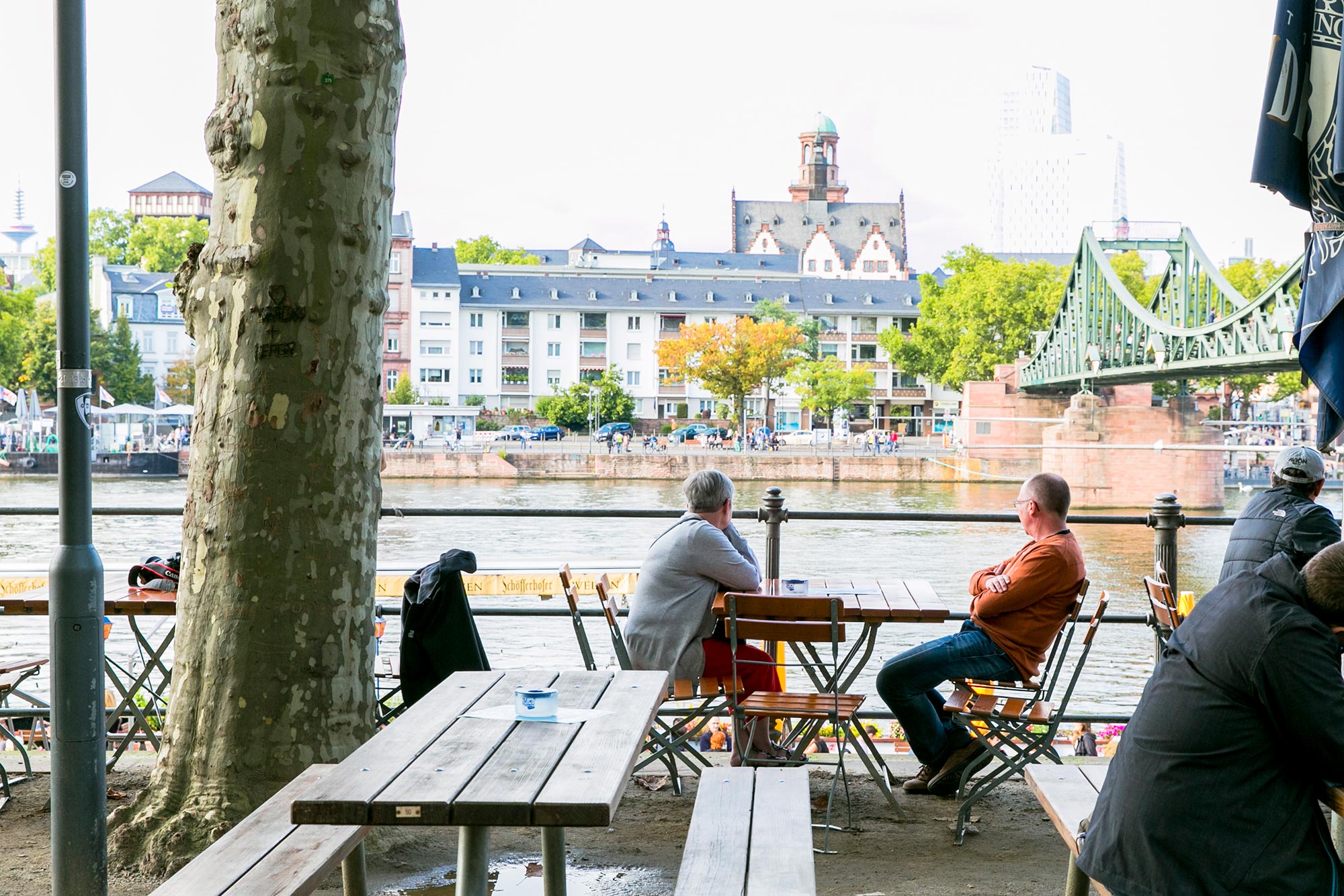 café on main river banks frankfurt